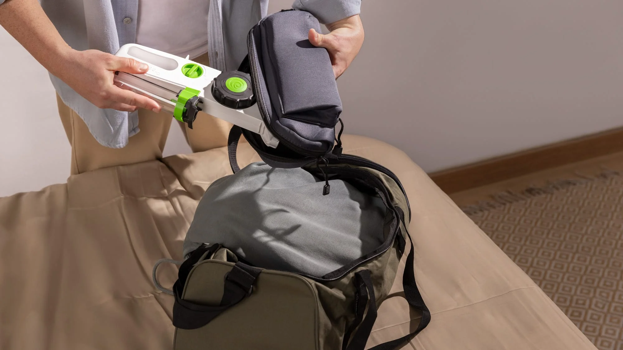 Person packing a Hizentra prefilled syringe case into a travel bag for a portable subcutaneous Ig infusion